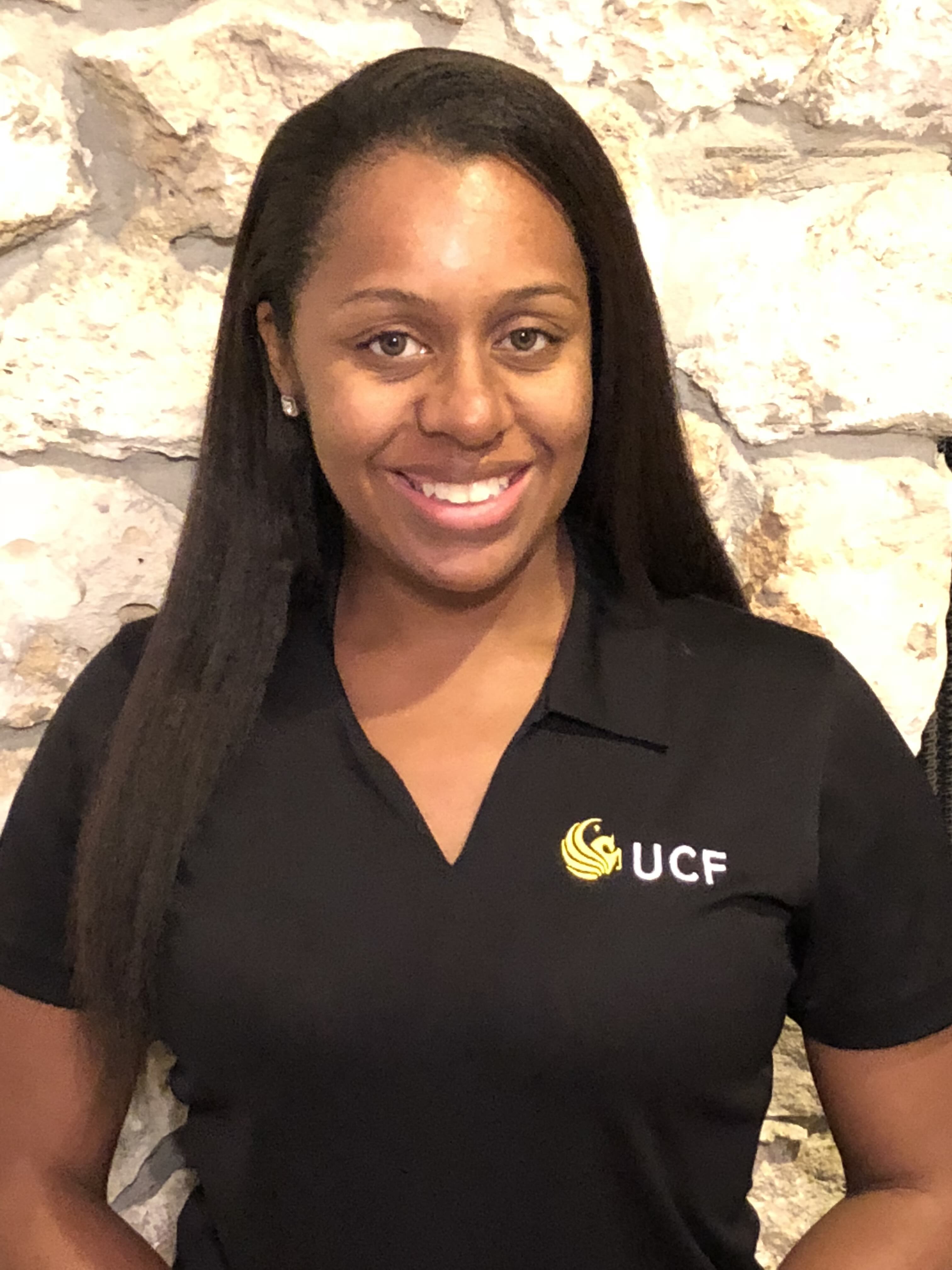 Tamara wearing a UCF polo shirt